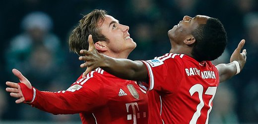 Bayern's Mario Goetze, left, and Bayern's David Alaba of Austria celebrate after scoring during the German first division Bundesliga soccer match between VfL Borussia Moenchengladbach and Bayern Munich in Moenchengladbach, Germany, Friday, Jan. 24, 2014. (AP Photo/Frank Augstein)