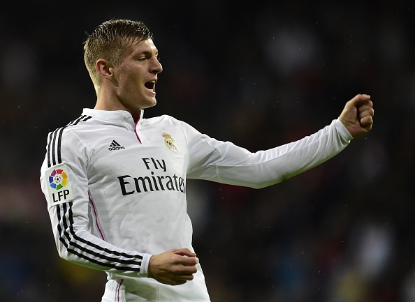 Real Madrid's German midfielder Toni Kroos  celebrates after scoring a goal during the Spanish league football match Real Madrid CF vs Rayo Vallecano at the Santiago Bernabeu stadium in Madrid on November 8, 2014.   AFP PHOTO/ JAVIER SORIANO        (Photo credit should read JAVIER SORIANO/AFP/Getty Images)